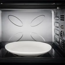 Clean microwave interior with a white turntable plate
